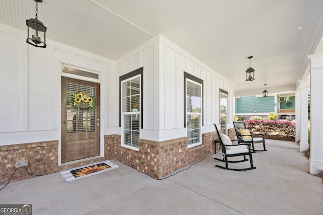 4044 Andover Cir, Mcdonough, GA 30252 - entrance to property with a porch, board and batten siding, and brick siding