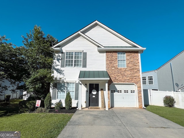105 Sheffield Dr, Carrollton, GA 30117 - view of front of home featuring concrete driveway, stone siding, a garage, a standing seam roof, and metal roof