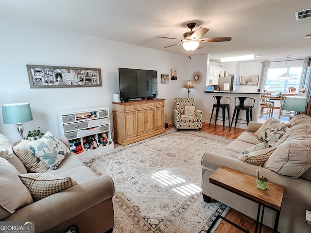 105 Sheffield Dr, Carrollton, GA 30117 - living room featuring ceiling fan and light wood-style floors