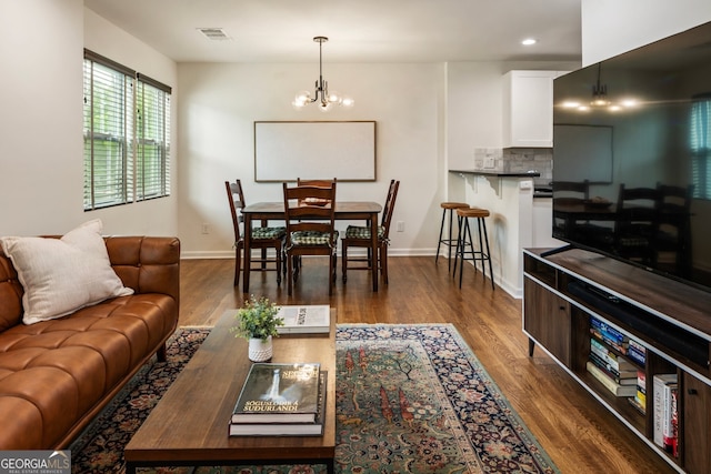 429 Deckner Ave SW, Atlanta, GA 30310 - living area featuring a chandelier, dark wood-type flooring, recessed lighting, and baseboards