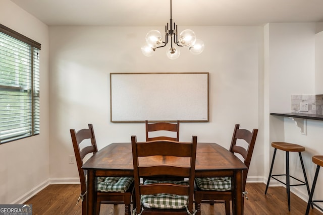 429 Deckner Ave SW, Atlanta, GA 30310 - dining area featuring wood finished floors, a chandelier, and baseboards