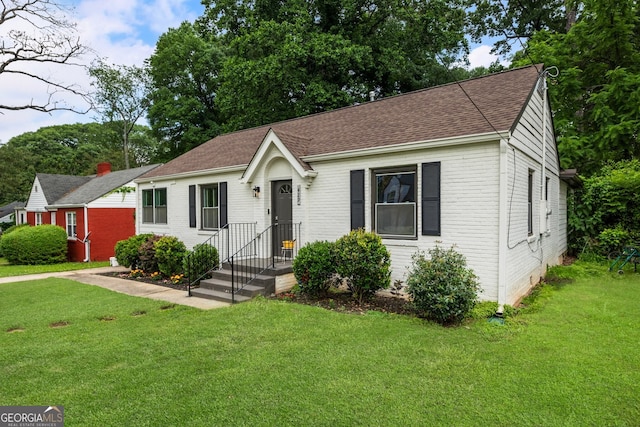 429 Deckner Ave SW, Atlanta, GA 30310 - bungalow-style house with brick siding, a front yard, and a shingled roof