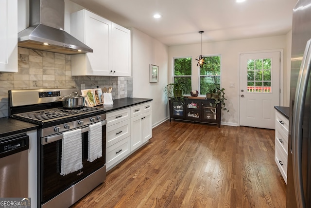429 Deckner Ave SW, Atlanta, GA 30310 - kitchen with appliances with stainless steel finishes, wall chimney range hood, dark countertops, healthy amount of natural light, and recessed lighting