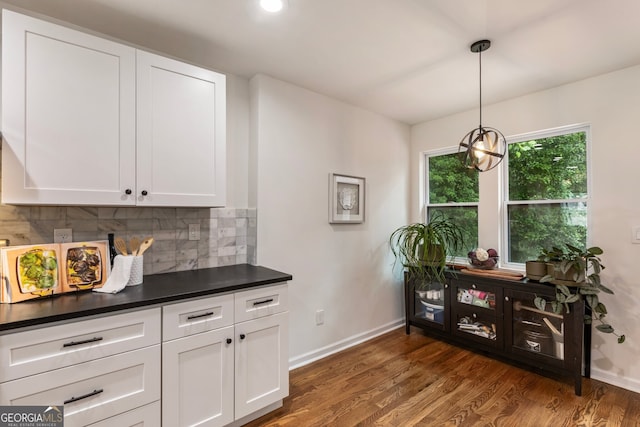 429 Deckner Ave SW, Atlanta, GA 30310 - kitchen with baseboards, decorative backsplash, dark countertops, and dark wood-style flooring