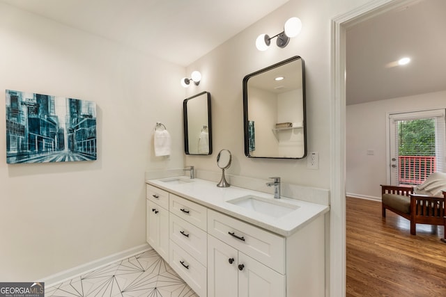 429 Deckner Ave SW, Atlanta, GA 30310 - bathroom with double vanity, baseboards, and wood finished floors