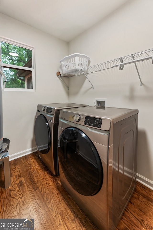429 Deckner Ave SW, Atlanta, GA 30310 - laundry room featuring separate washer and dryer, dark wood finished floors, and baseboards
