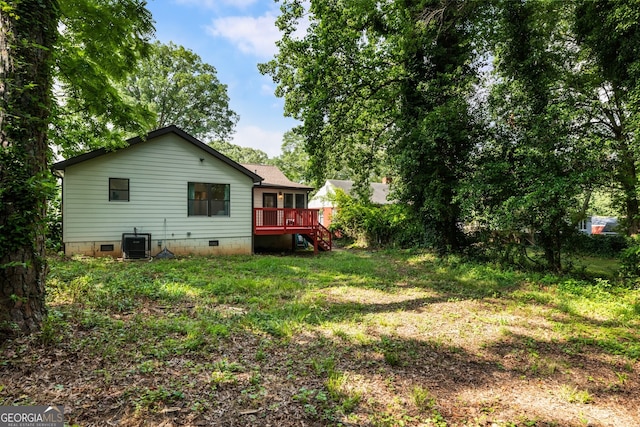 429 Deckner Ave SW, Atlanta, GA 30310 - back of property featuring crawl space, a wooden deck, central air condition unit, a yard, and stairs
