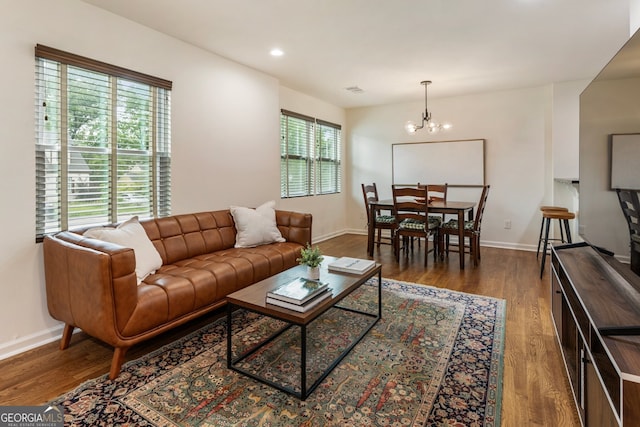 429 Deckner Ave SW, Atlanta, GA 30310 - living room featuring wood finished floors, a chandelier, baseboards, and recessed lighting