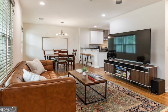 429 Deckner Ave SW, Atlanta, GA 30310 - living room featuring wood finished floors, recessed lighting, a chandelier, and baseboards