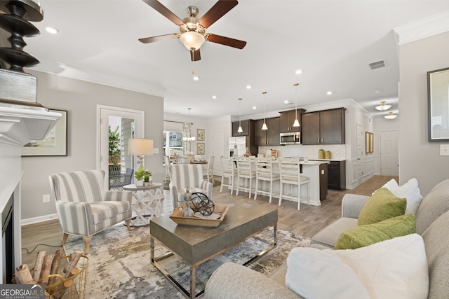 237 Orion Dr, Dalton, GA 30720 - living room featuring crown molding, recessed lighting, ceiling fan, light wood-type flooring, and baseboards