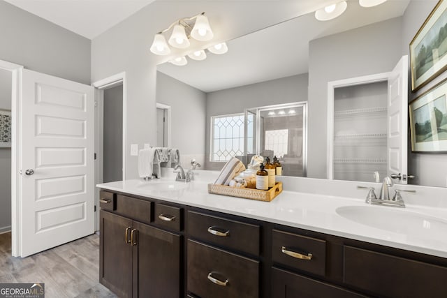 237 Orion Dr, Dalton, GA 30720 - bathroom with double vanity, wood finished floors, and a stall shower