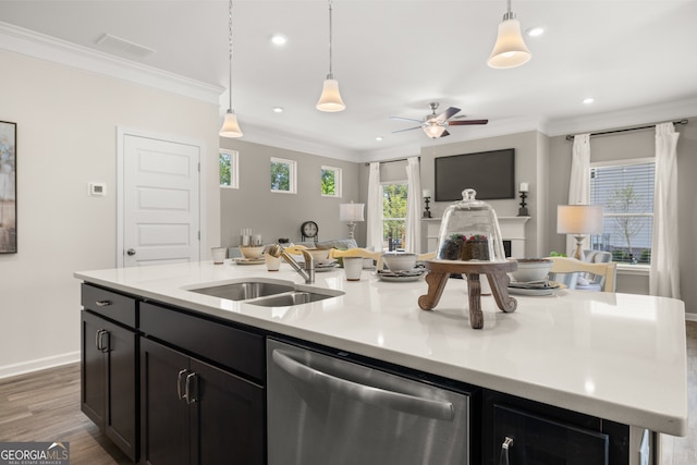 237 Orion Dr, Dalton, GA 30720 - kitchen with stainless steel dishwasher, open floor plan, a sink, crown molding, and light countertops
