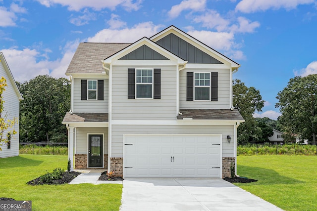 303 Limestone Cir, Conyers, GA 30013 - craftsman inspired home featuring brick siding, driveway, a front yard, a garage, and board and batten siding