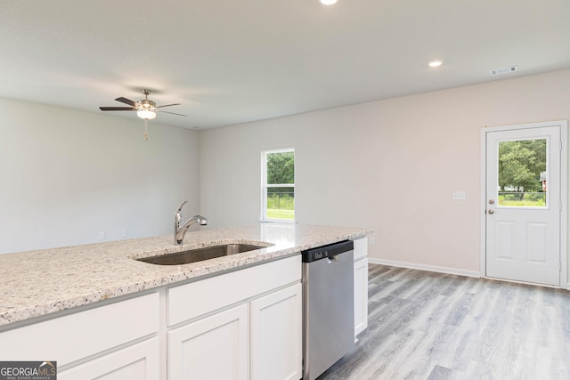 303 Limestone Cir, Conyers, GA 30013 - kitchen featuring dishwasher, a sink, white cabinets, light stone countertops, and light wood-type flooring