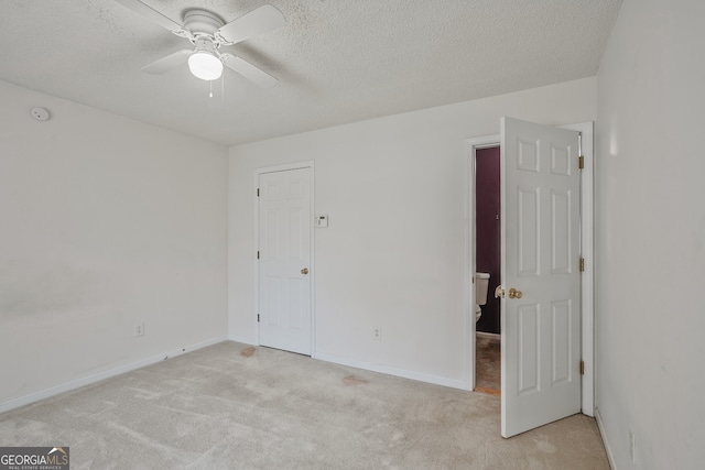3524 Forest Downs Cv, Decatur, GA 30034 - unfurnished room with light colored carpet, a ceiling fan, a textured ceiling, a smoke detector, and baseboards