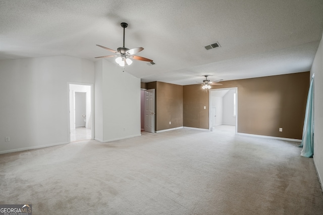 3524 Forest Downs Cv, Decatur, GA 30034 - spare room with ceiling fan, light carpet, lofted ceiling, baseboards, and a textured ceiling