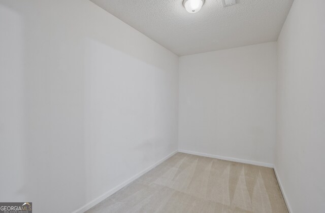3524 Forest Downs Cv, Decatur, GA 30034 - unfurnished room featuring light carpet, baseboards, and a textured ceiling