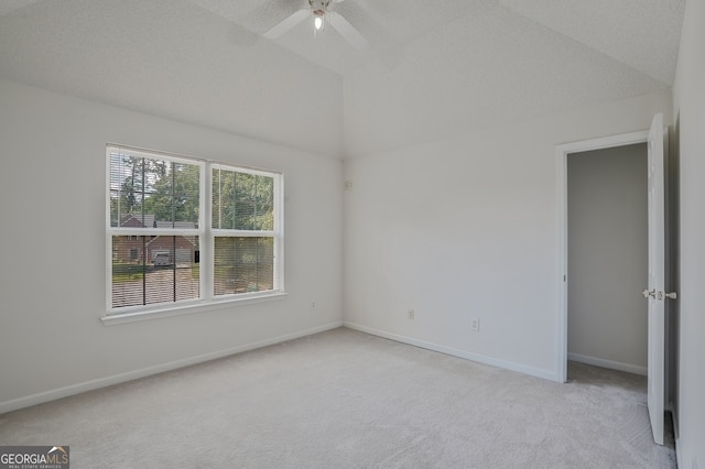 3524 Forest Downs Cv, Decatur, GA 30034 - spare room featuring light carpet, a ceiling fan, vaulted ceiling, and baseboards