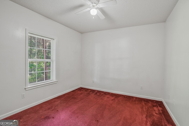 3524 Forest Downs Cv, Decatur, GA 30034 - spare room with dark carpet, ceiling fan, baseboards, and a textured ceiling