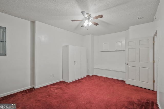 3524 Forest Downs Cv, Decatur, GA 30034 - unfurnished bedroom featuring carpet flooring, a textured ceiling, baseboards, and ceiling fan