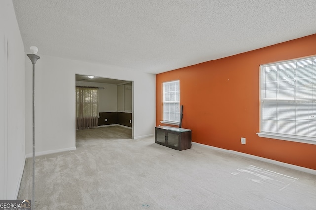 3524 Forest Downs Cv, Decatur, GA 30034 - unfurnished room featuring healthy amount of natural light, a textured ceiling, and light carpet