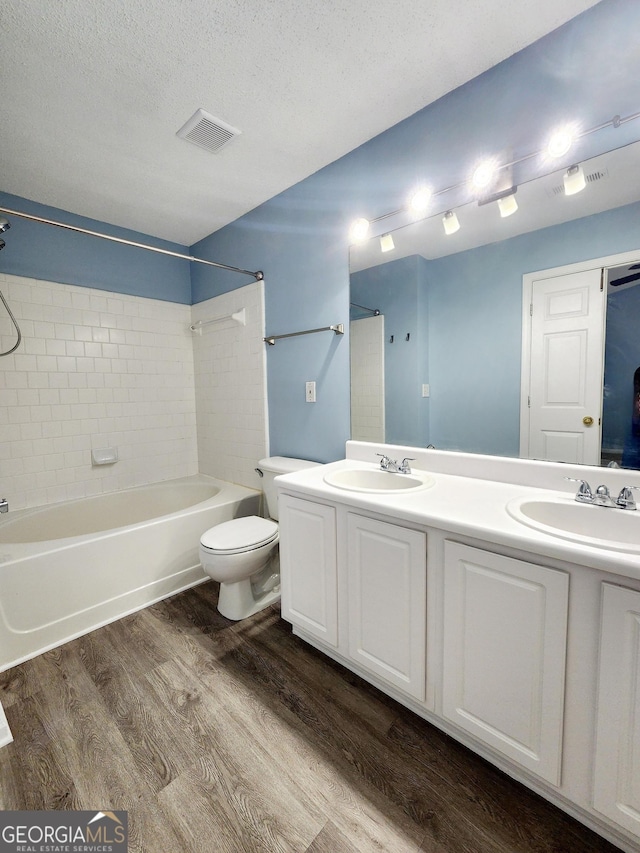 10900 Wittenridge Dr Unit H8, Alpharetta, GA 30022 - bathroom with wood finished floors,  shower combination, double vanity, toilet, and a textured ceiling