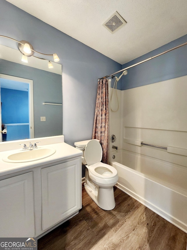 10900 Wittenridge Dr Unit H8, Alpharetta, GA 30022 - bathroom with toilet, shower / bathtub combination with curtain, wood finished floors, vanity, and a textured ceiling