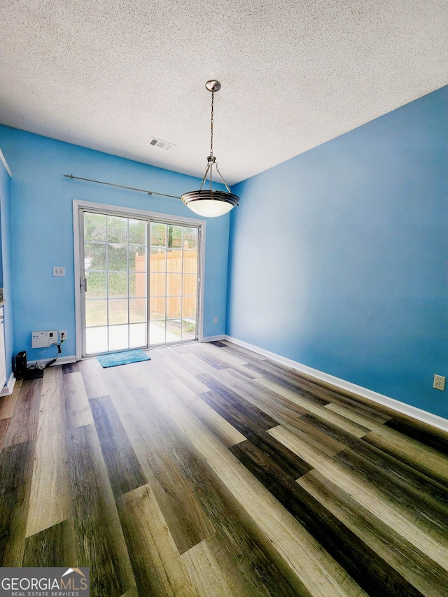 10900 Wittenridge Dr Unit H8, Alpharetta, GA 30022 - spare room with wood finished floors, a textured ceiling, and baseboards