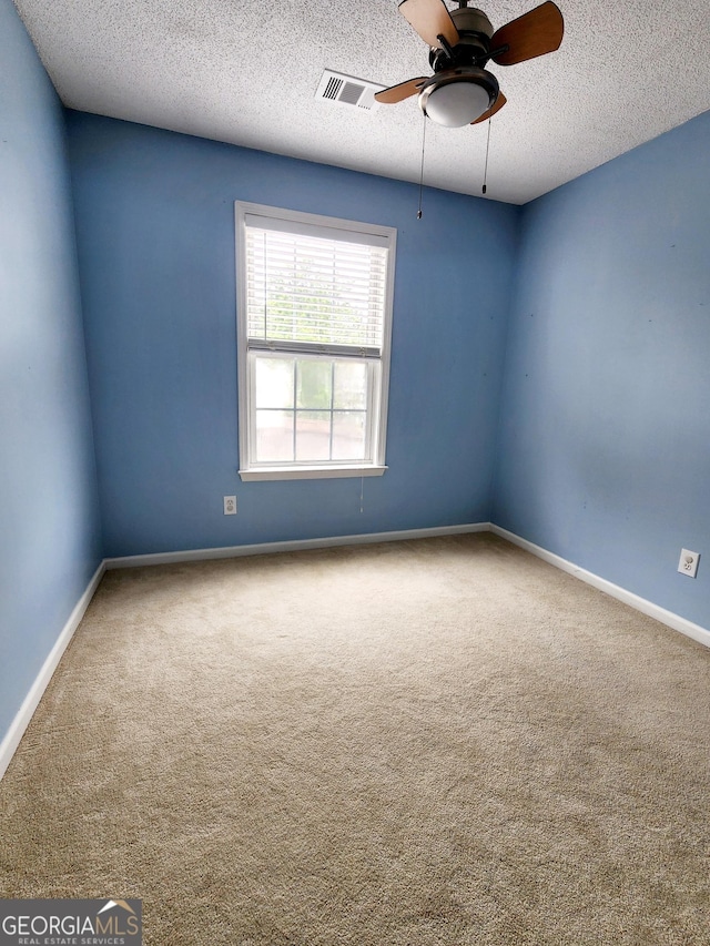 10900 Wittenridge Dr Unit H8, Alpharetta, GA 30022 - carpeted spare room featuring a ceiling fan, baseboards, and a textured ceiling