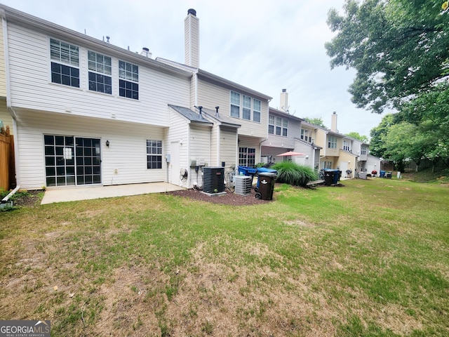 10900 Wittenridge Dr Unit H8, Alpharetta, GA 30022 - rear view of property featuring a yard, central air condition unit, a patio, and a chimney