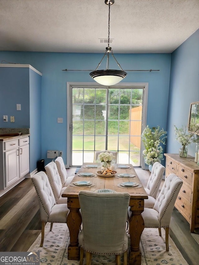 10900 Wittenridge Dr Unit H8, Alpharetta, GA 30022 - dining room featuring wood finished floors and a textured ceiling