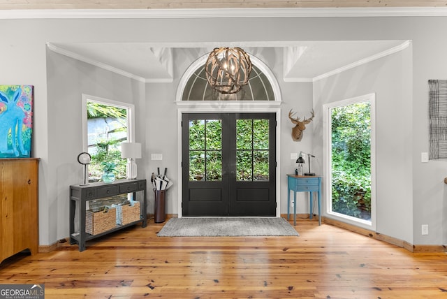 1431 Tame Turkey Rd, Lakemont, GA 30552 - entrance foyer with hardwood / wood-style flooring, a chandelier, healthy amount of natural light, and crown molding