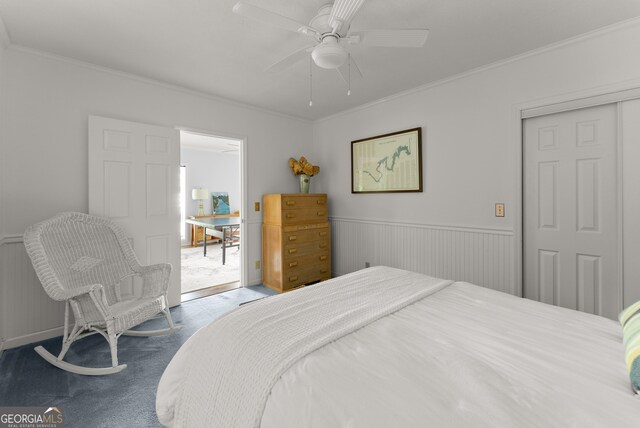 1431 Tame Turkey Rd, Lakemont, GA 30552 - bedroom with carpet floors, crown molding, a closet, ceiling fan, and a wainscoted wall