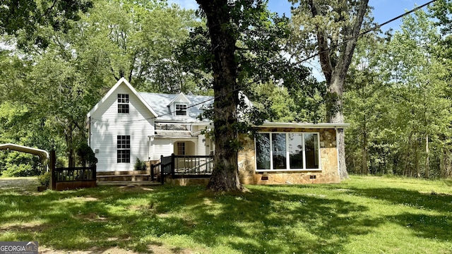 4850 New Liberty Rd, Clarkesville, GA 30523 - back of house with stone siding, a lawn, and a wooden deck