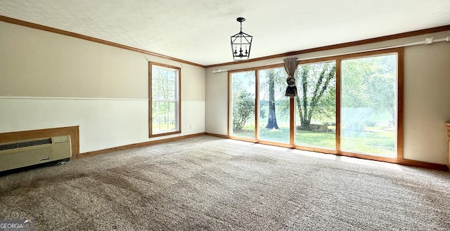 4850 New Liberty Rd, Clarkesville, GA 30523 - unfurnished living room featuring ornamental molding, carpet floors, an AC wall unit, and baseboards