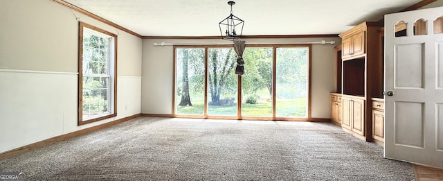 4850 New Liberty Rd, Clarkesville, GA 30523 - unfurnished dining area with crown molding, baseboards, and light carpet