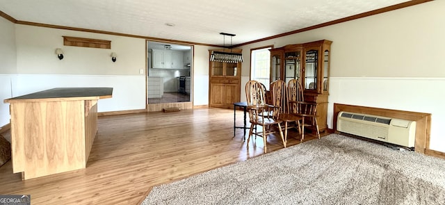 4850 New Liberty Rd, Clarkesville, GA 30523 - dining area with ornamental molding, wood finished floors, wainscoting, and a wall unit AC