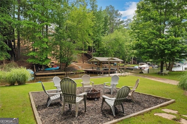 197 White Antelope St, Waleska, GA 30183 - view of green lawn featuring an outdoor fire pit, view of wooded area, and a water view