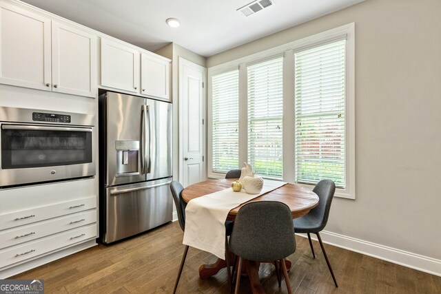 123 Mulberry Ct, Peachtree City, GA 30269 - dining space featuring baseboards, wood finished floors, and recessed lighting