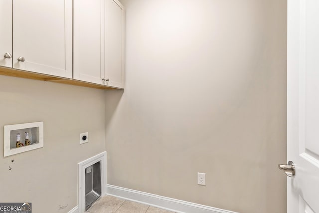 123 Mulberry Ct, Peachtree City, GA 30269 - laundry area featuring cabinet space, electric dryer hookup, washer hookup, baseboards, and light tile patterned flooring