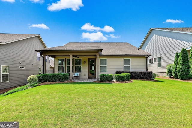 123 Mulberry Ct, Peachtree City, GA 30269 - view of front facade with ceiling fan, a front yard, and a shingled roof