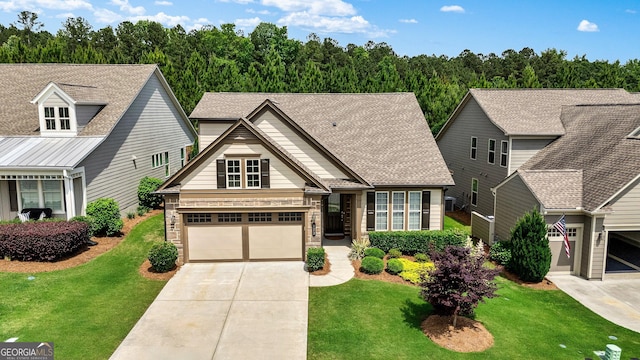 123 Mulberry Ct, Peachtree City, GA 30269 - view of front facade with concrete driveway, a front lawn, a garage, and stone siding