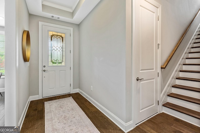 123 Mulberry Ct, Peachtree City, GA 30269 - foyer entrance with dark wood-type flooring, stairs, baseboards, and crown molding