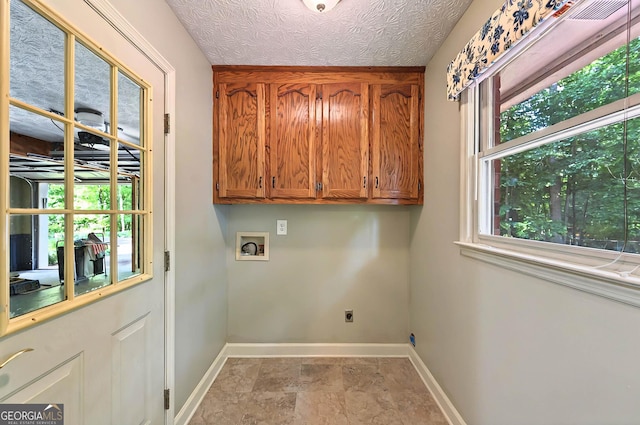 299 Fieldview Dr, Auburn, GA 30011 - washroom with cabinet space, hookup for a washing machine, electric dryer hookup, baseboards, and stone finish floors