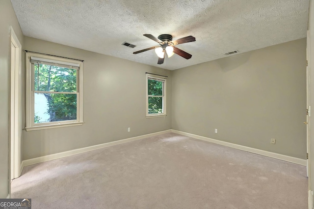 299 Fieldview Dr, Auburn, GA 30011 - empty room featuring a ceiling fan, healthy amount of natural light, baseboards, and a textured ceiling