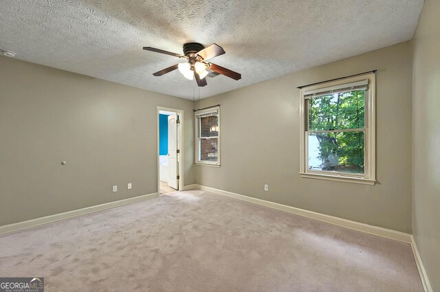299 Fieldview Dr, Auburn, GA 30011 - spare room featuring a ceiling fan, baseboards, carpet floors, and a textured ceiling