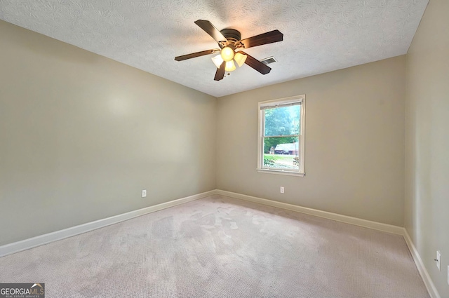 299 Fieldview Dr, Auburn, GA 30011 - unfurnished room featuring a ceiling fan, light carpet, baseboards, and a textured ceiling