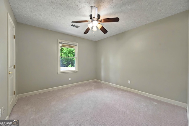 299 Fieldview Dr, Auburn, GA 30011 - empty room with ceiling fan, light carpet, baseboards, and a textured ceiling