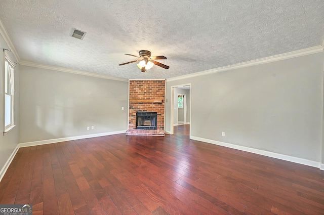 299 Fieldview Dr, Auburn, GA 30011 - unfurnished living room with wood-type flooring, ceiling fan, baseboards, a brick fireplace, and ornamental molding