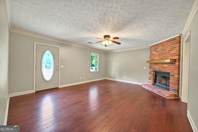 299 Fieldview Dr, Auburn, GA 30011 - unfurnished living room featuring a ceiling fan, a fireplace, hardwood / wood-style flooring, baseboards, and ornamental molding